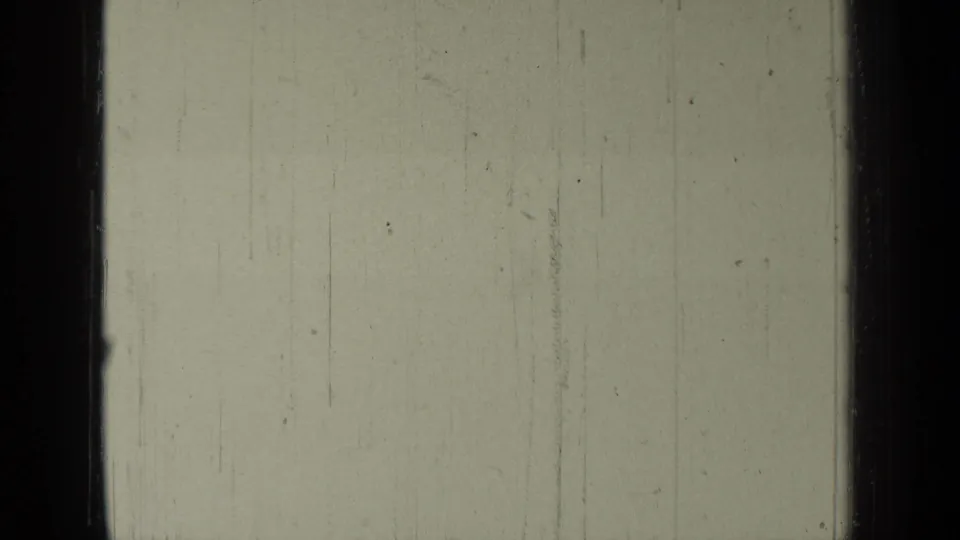 Early frame in the Bend, Oregon 1937 home movie, showing pale sky-like exposure, dark frame edges, and aged film markings.