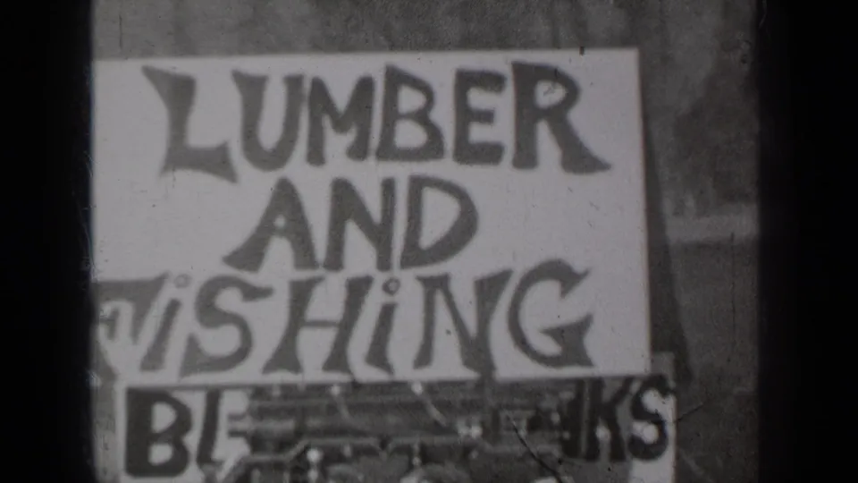 1937 Klamath, California 8mm still showing the sign from a slightly lower crop, with lower lettering partly obscured.