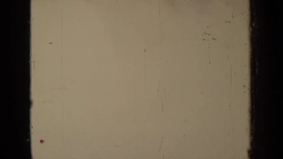 Faded 8mm footage from the Klamath clip shows a central dark film band, scratches, and a washed outdoor field of view.