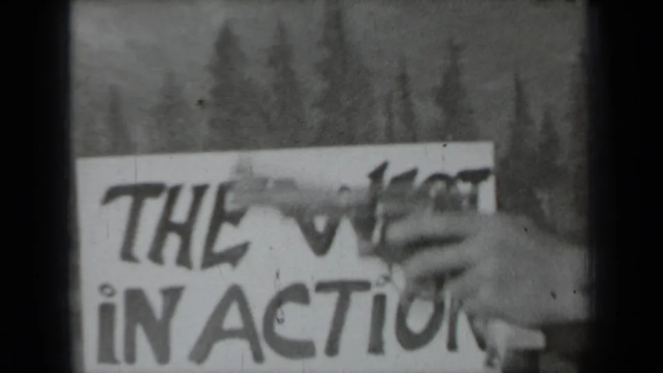 The person’s hand and revolvers move across the THE WEST IN ACTION sign in the 1937 Klamath footage.