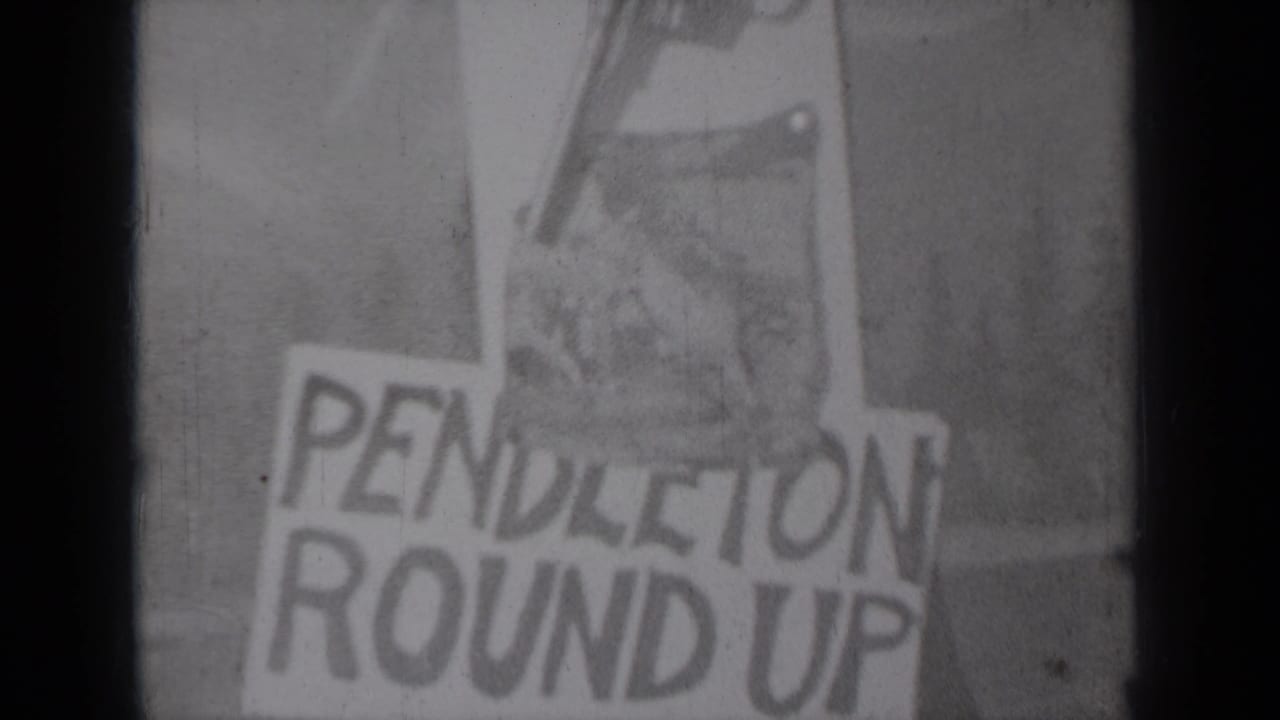 1937 Klamath, California frame holding on the hand-drawn Pendleton Round Up notice with a revolver illustration and visible film wear.