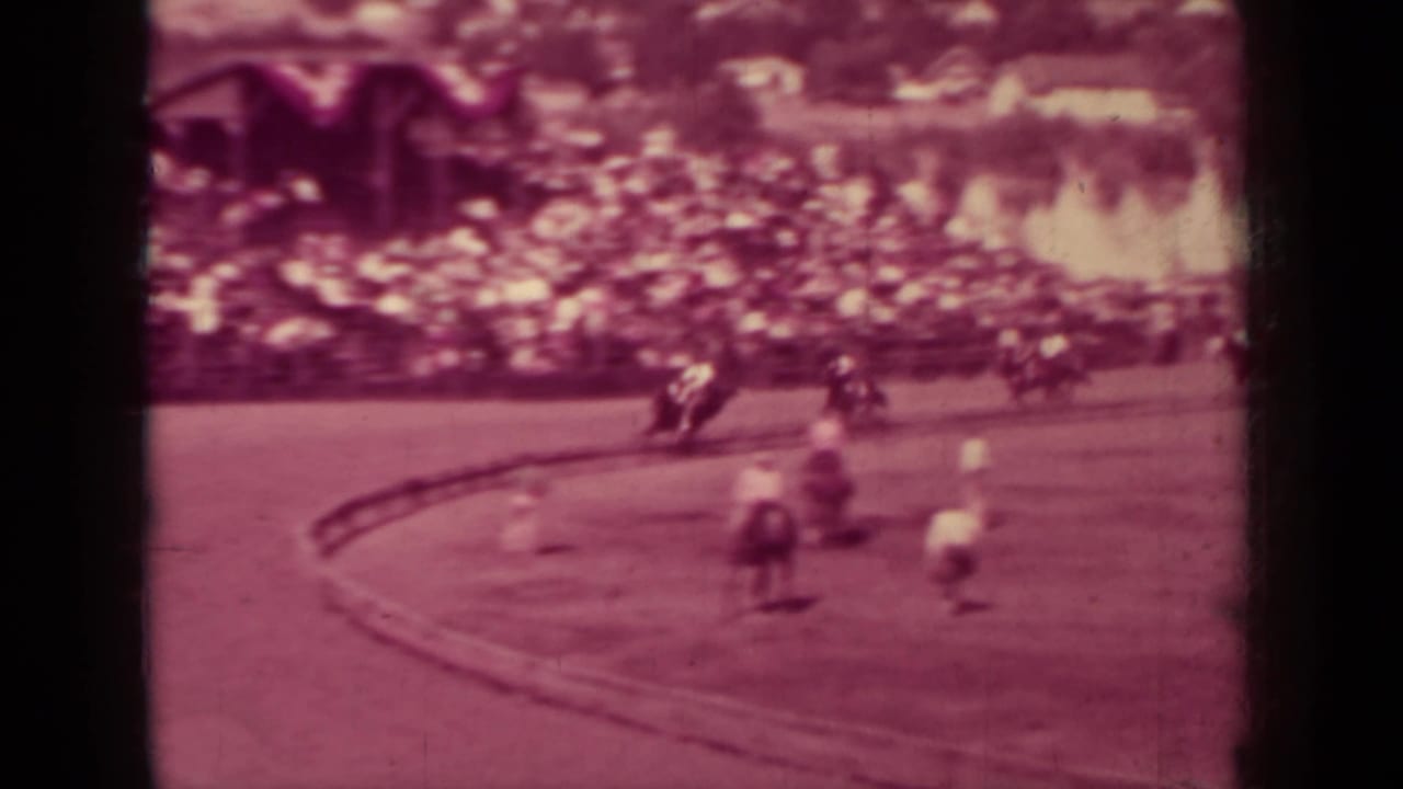 Home-movie view of riders on horseback passing the bend of a Klamath, California dirt racing track in 1937.
