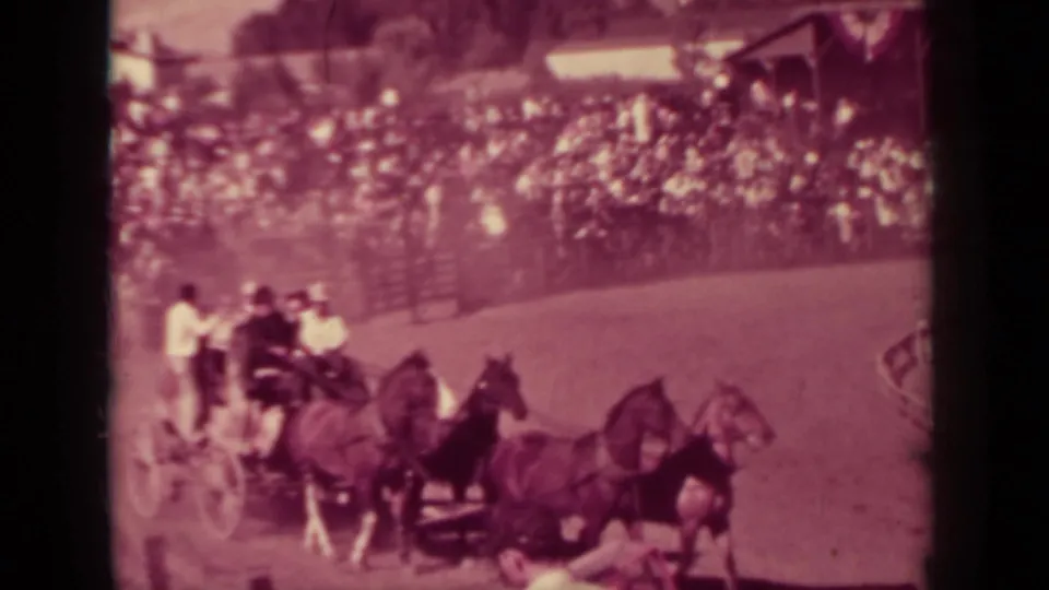 In the supplied 1937 Klamath fair footage, horse teams pull carriages around a dirt track before packed stands.