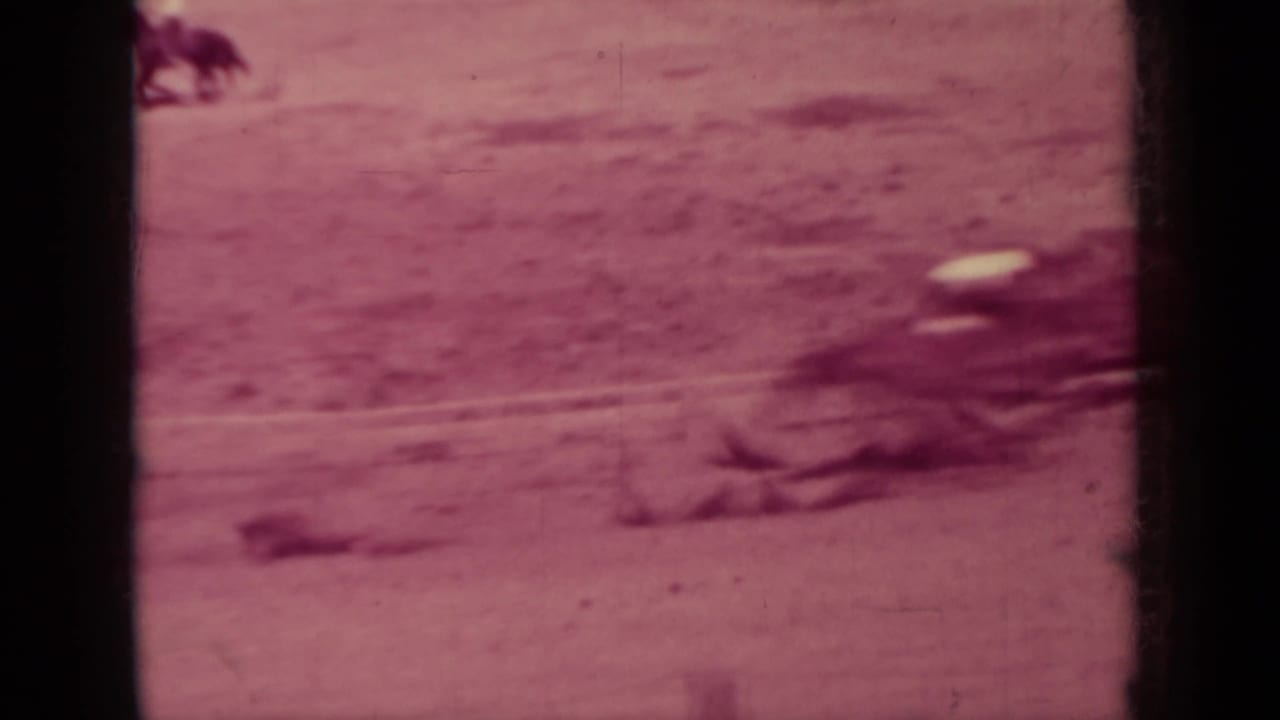 A horse and rider move through the right side of a dusty race track in the 1937 Klamath home-movie clip.