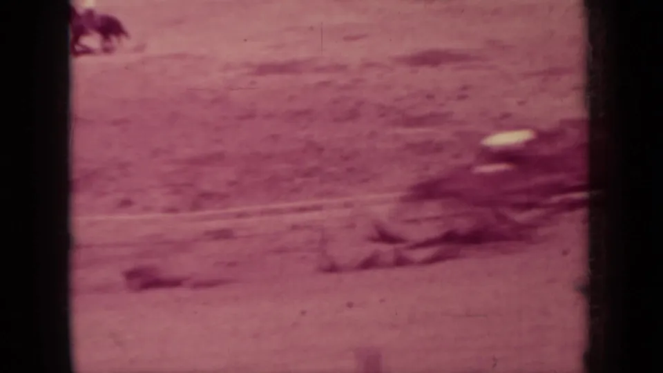 A horse and rider move through the right side of a dusty race track in the 1937 Klamath home-movie clip.