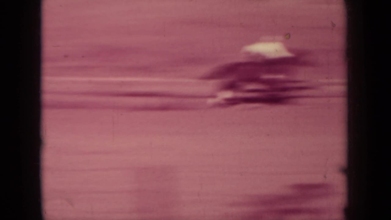 Klamath, California rodeo footage from 1937 showing a fast-moving horse and rider blurred by motion on 8mm film.