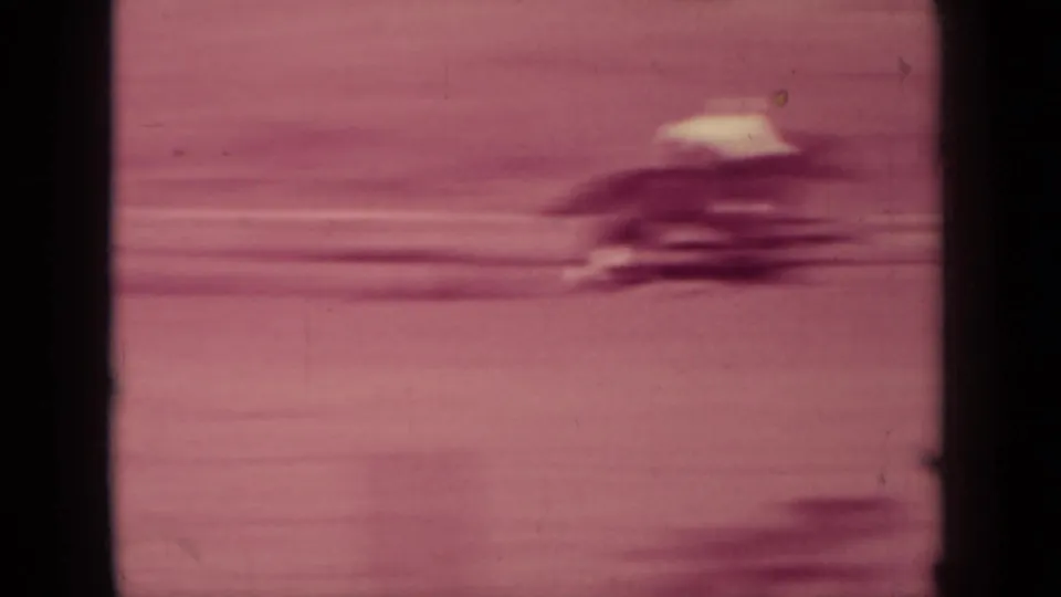 Klamath, California rodeo footage from 1937 showing a fast-moving horse and rider blurred by motion on 8mm film.