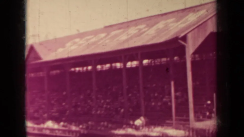 1937 Klamath, California frame of a large seated audience under an open-sided wooden pavilion roof.