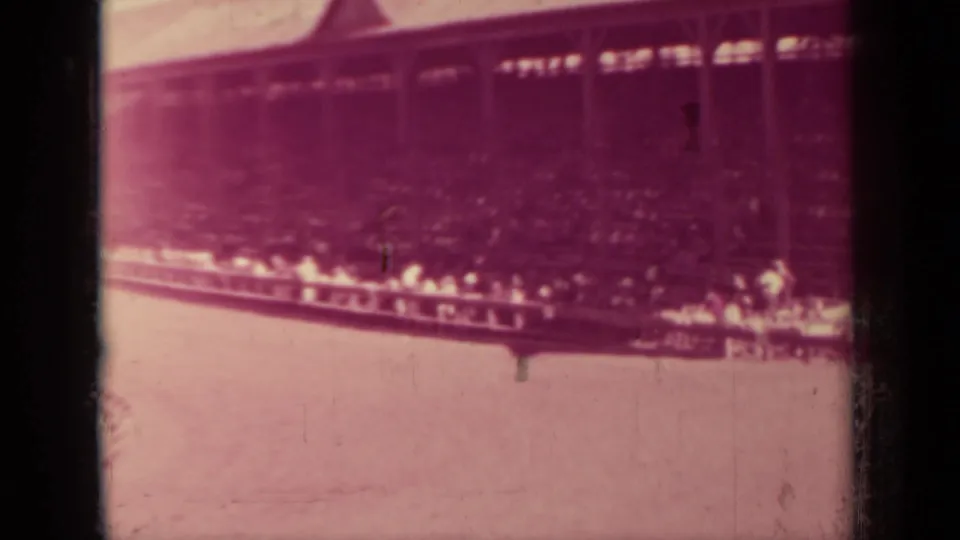 1937 Klamath, California home-movie view of a crowded grandstand-like pavilion beside open ground.