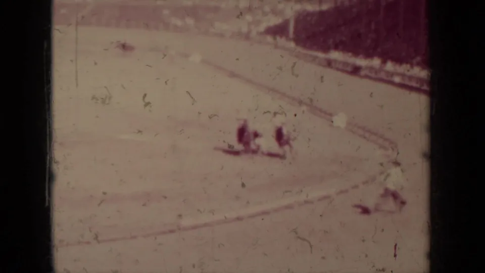 Faded 1937 Klamath home-movie frame showing two horseback riders near the lower edge of a dirt arena.