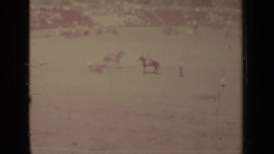 Soft, faded 1937 Klamath racetrack frame showing horses and riders at a distance with heavy film exposure loss.