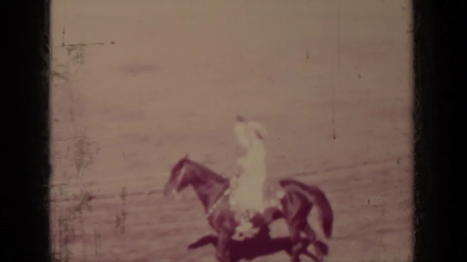 In 1937 Klamath, California footage, a man on horseback appears near the side of a dusty outdoor arena.