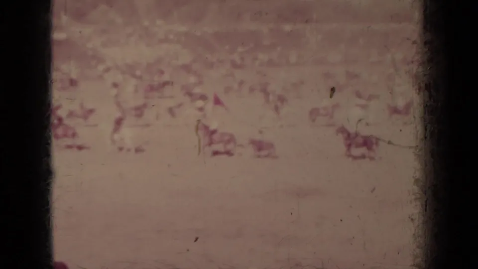 At the end of the clip, distant horseback riders remain scattered across the Klamath, California rodeo or riding field.