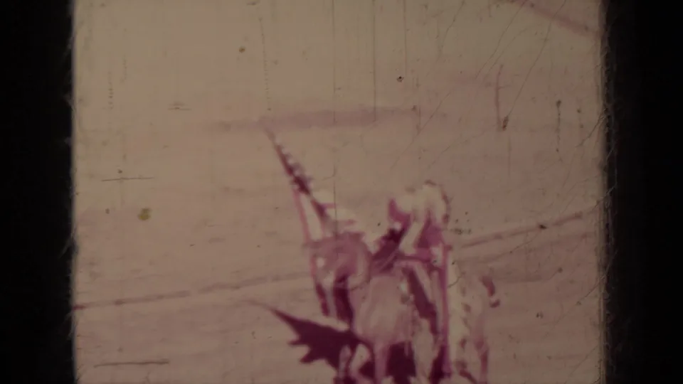 Distant riders in a 1937 Klamath arena scene carry an American flag during a staged horseback procession.