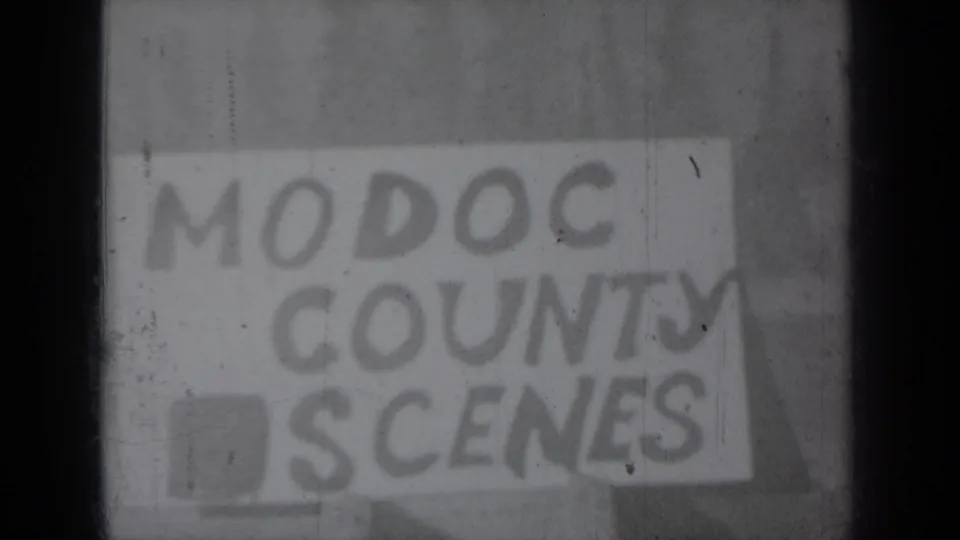 Hand-lettered “MODOC COUNTY SCENES” title card from the 1937 home-movie reel, seen through soft focus and film wear.