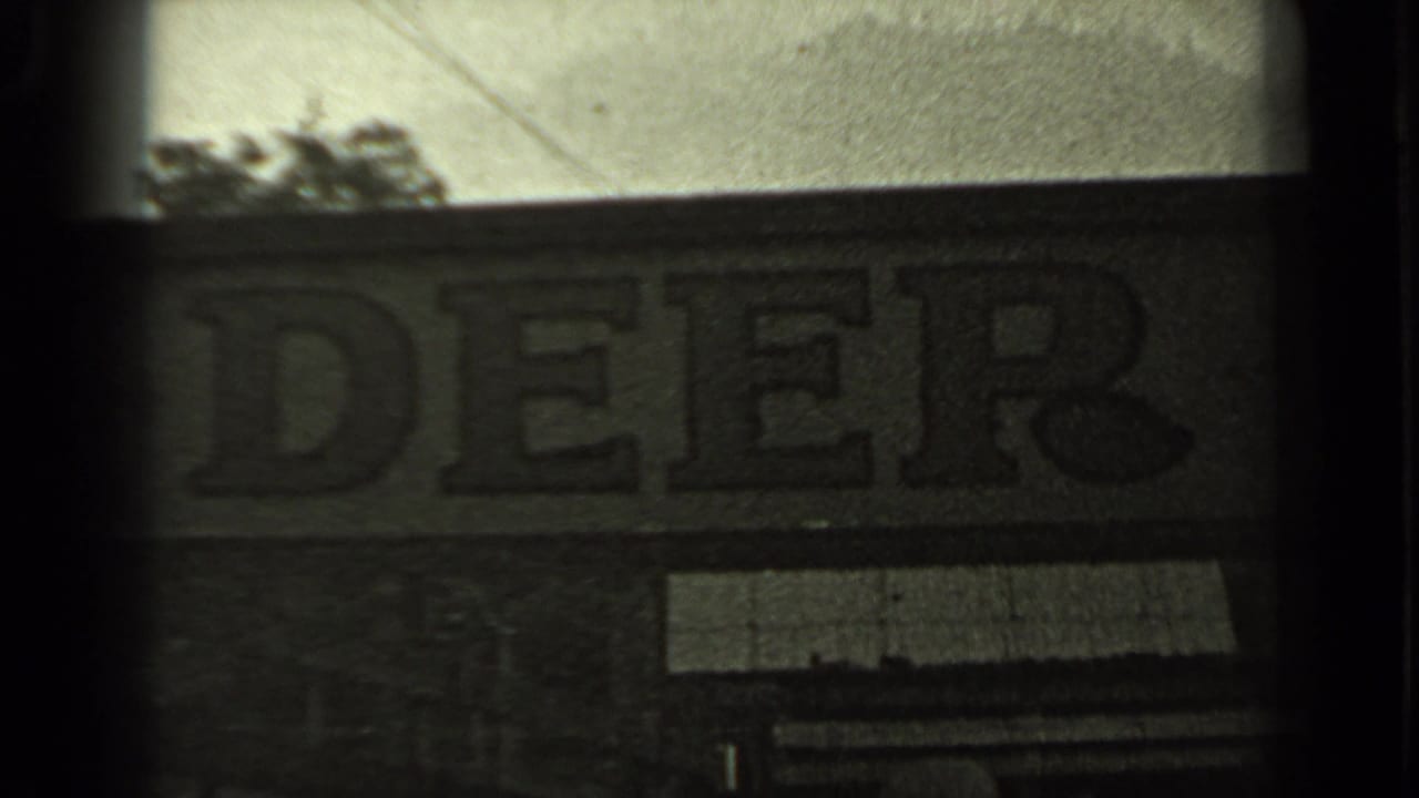 Closer view of the Mule Deer Bar sign and building frontage.