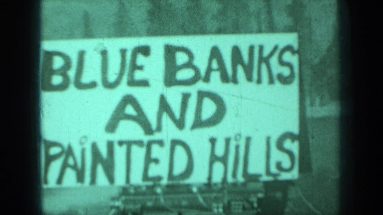 Close view of a hand-painted sign reading Blue Banks and Painted Hills.