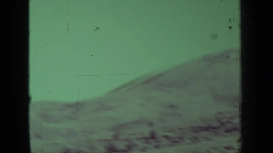Green-tinted 1937 8mm view of rolling rural terrain near Medford, Oregon, with soft focus and visible film wear.