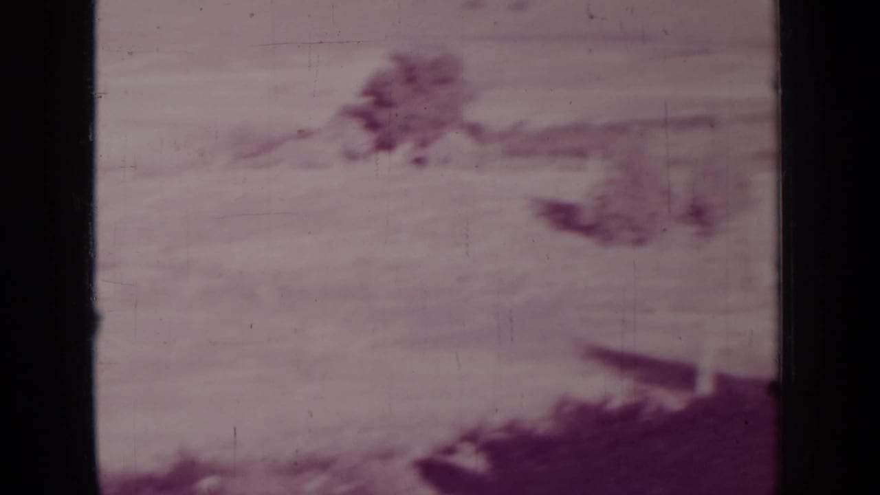 Distant dry hills and hazy sky seen through heavy film fading.