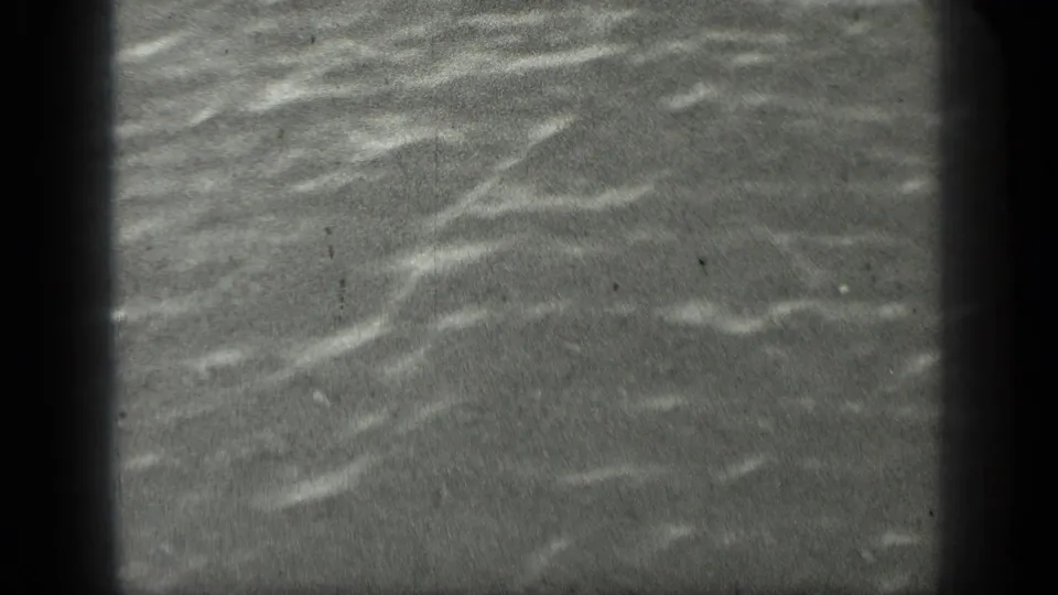 Rippling lake surface with soft highlights in a 1939 Long Lake, Canada 8mm frame.