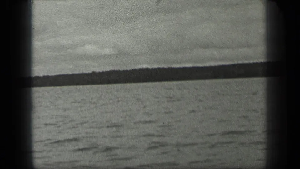 Long Lake, Canada water and far shore framed by dark 8mm film borders in a brief 1939 home-movie view.