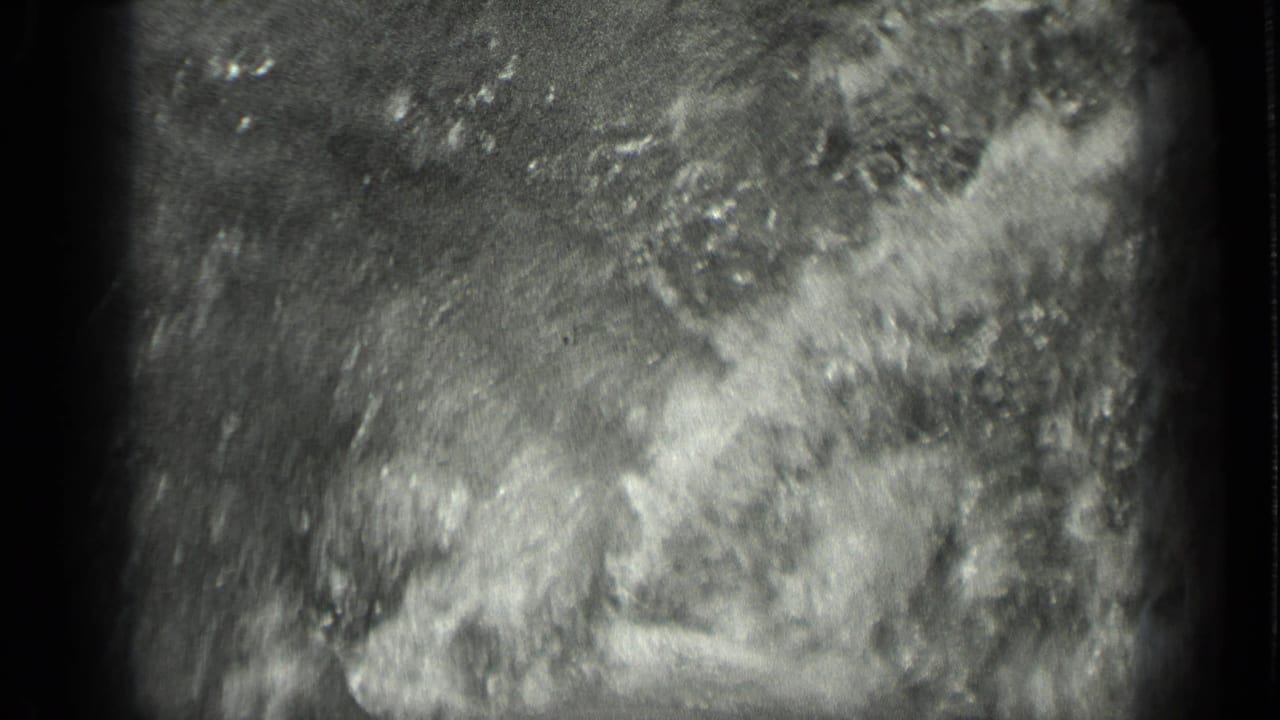 1939 8mm footage from Long Lake, Canada, showing abstract bright water movement and heavy film grain.