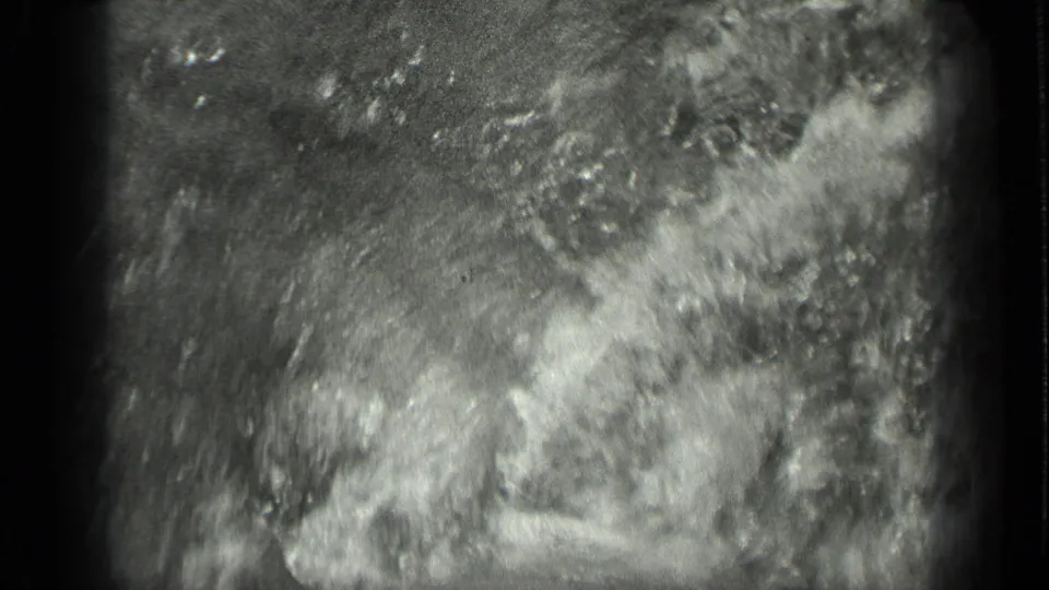 1939 8mm footage from Long Lake, Canada, showing abstract bright water movement and heavy film grain.