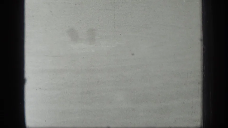 Soft, overexposed 1939 Long Lake, Canada frame with faint water texture and a barely visible swimmer shape near the upper left.
