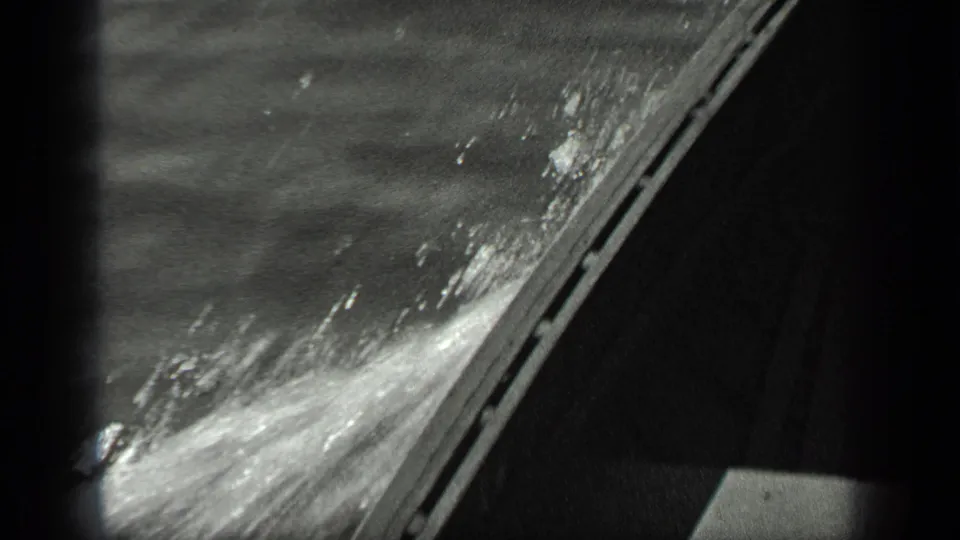 The final 1939 Long Lake frame shifts to rippling water beside a dark diagonal boat or dock edge.