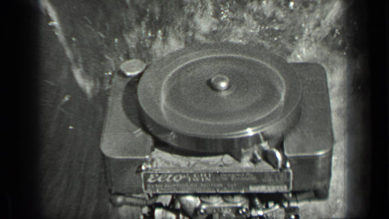 Close view of a film projector mechanism with a round reel or spool visible.