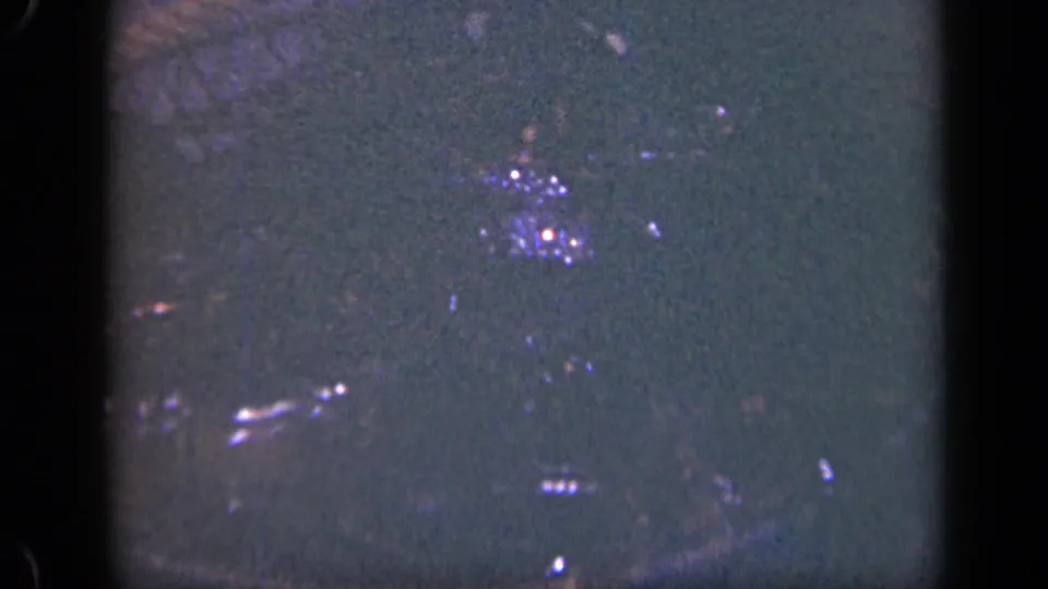Soft 8mm frame of wet lobsters clustered in a wire basket, likely from the 1948 Long Island fishing clip.