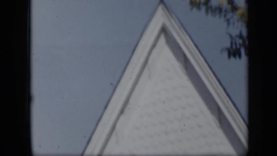 White church gable and roofline appear against a clear sky, matching the Aledo church location noted in the metadata.