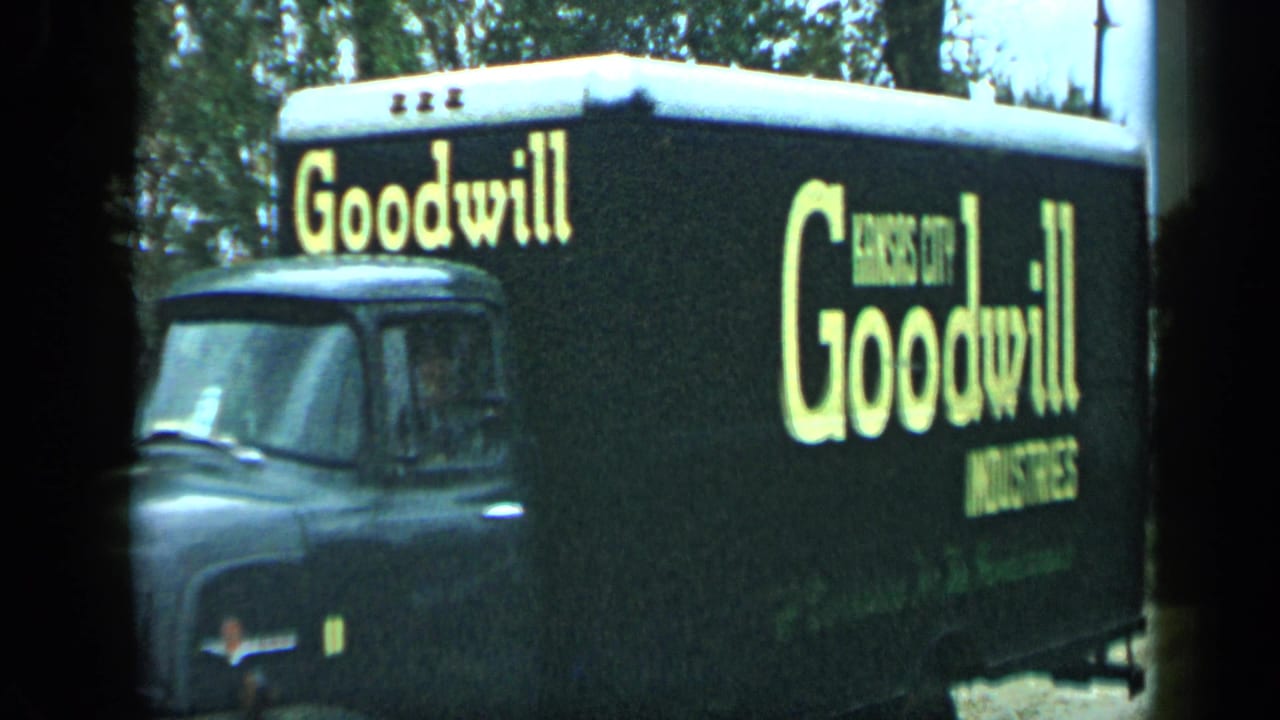 Goodwill Industries truck side with large yellow lettering.