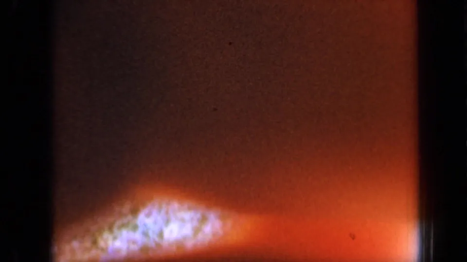 Final 8mm frame appears mostly dark red-orange with a bright flare, suggesting overexposed or transitional film material.