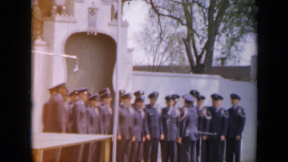 The closing frame shows the Iowa cadet group still assembled outdoors, with officers nearby and strong warm 8mm exposure.