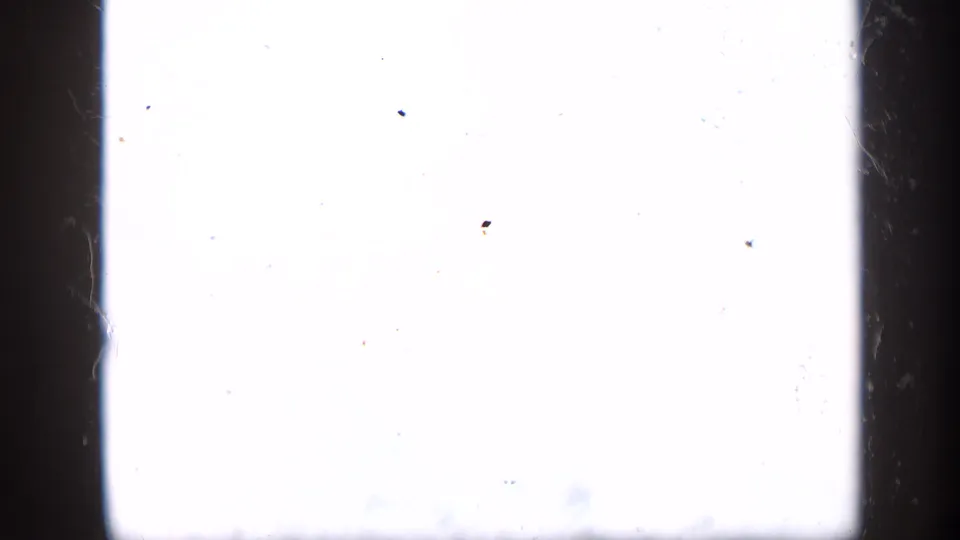 Overexposed 8mm frame from the 1959 Venezuela clip, mostly white with visible dust and gate edges.