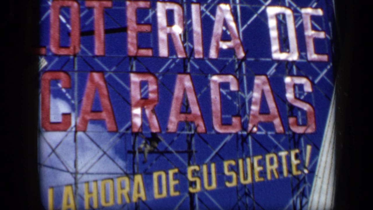 1959 Venezuela frame of the blue lottery sign with scaffold lines, yellow slogan text, and a worker visible near the center.