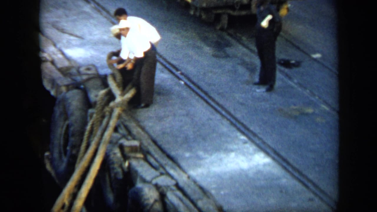The 1959 Venezuela footage shows a dock worker handling thick ropes from above, with an observer nearby on the quay.
