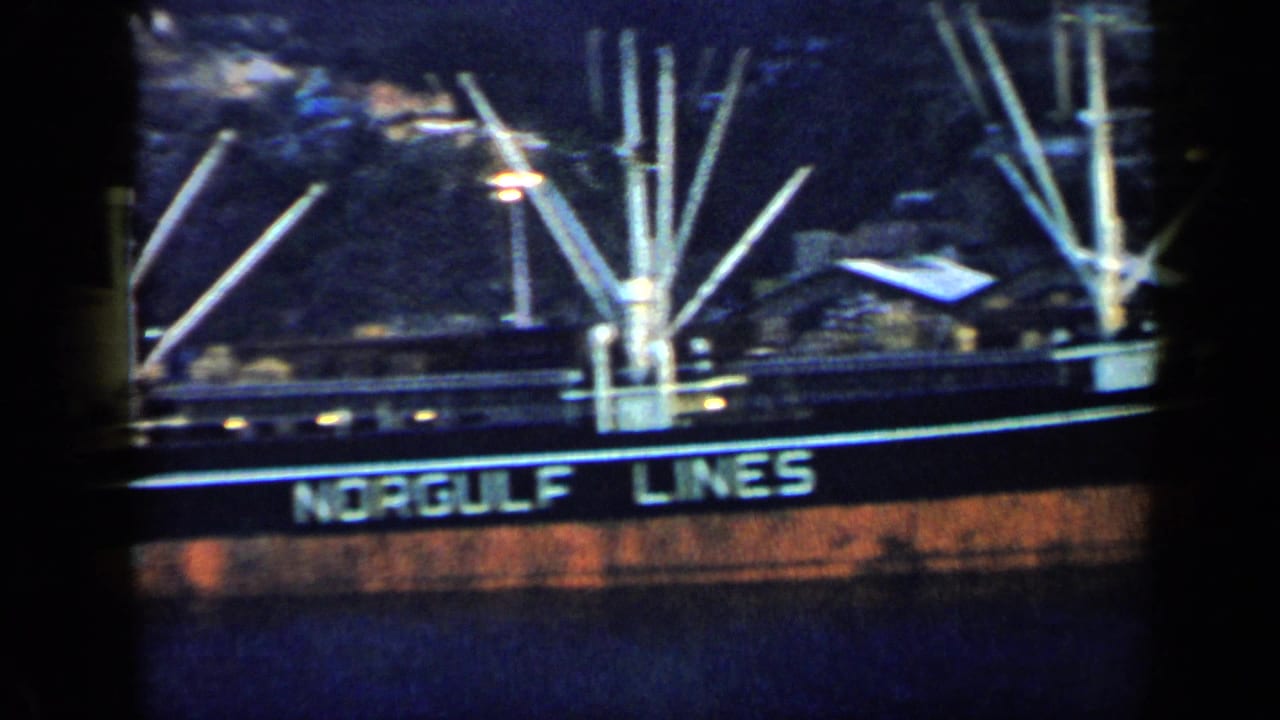 1959 Venezuela frame with readable NORGULF LUNES lettering on a docked vessel, with masts or deck gear above.
