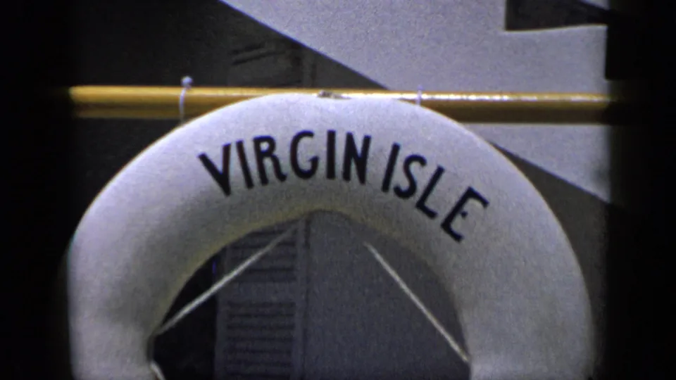 Close 8mm view of a white Virgin Isle buoy with wall slats visible through its center.