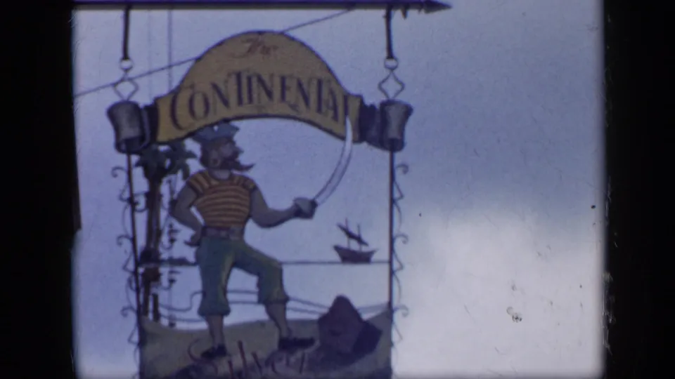 Hanging Continental sign in Venezuela, illustrated with a nautical pirate or sailor figure and a small ship motif.