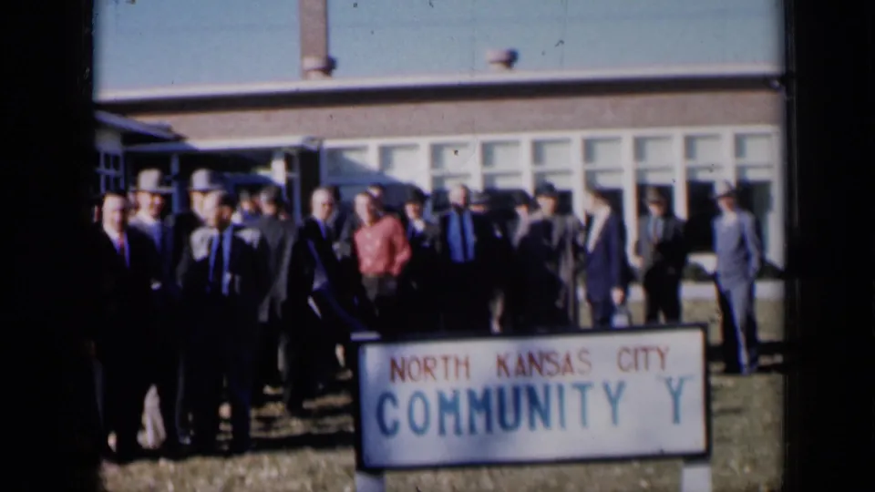 A larger view of the 1961 Missouri group shows adults posed by the North Kansas City Community Y sign with the mid-century building behind them.