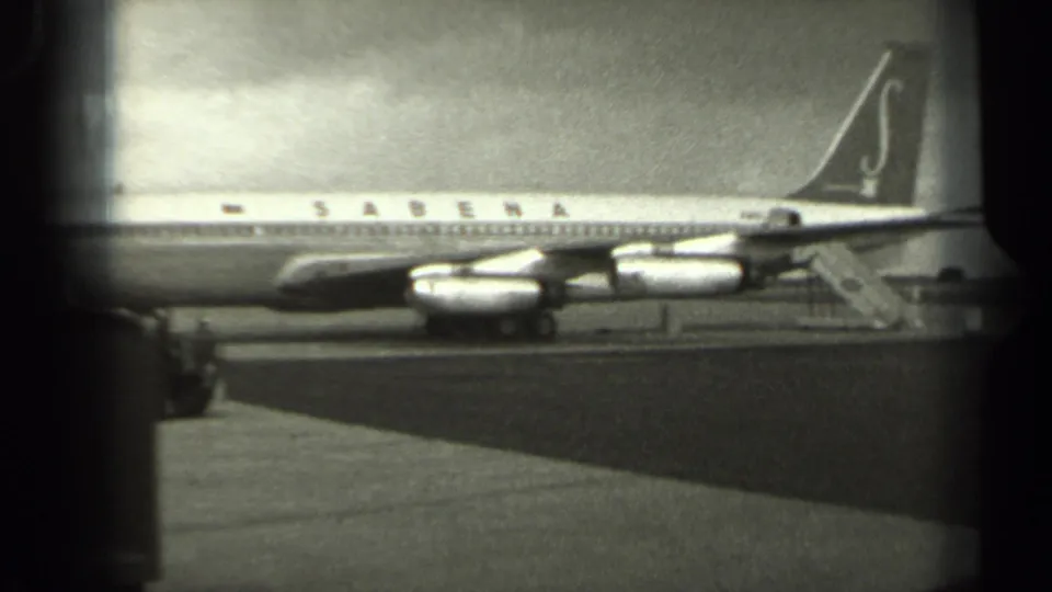 A side view of the Sabena passenger aircraft in Missouri, 1961, shows the tail, engines, and fuselage against a cloudy sky.