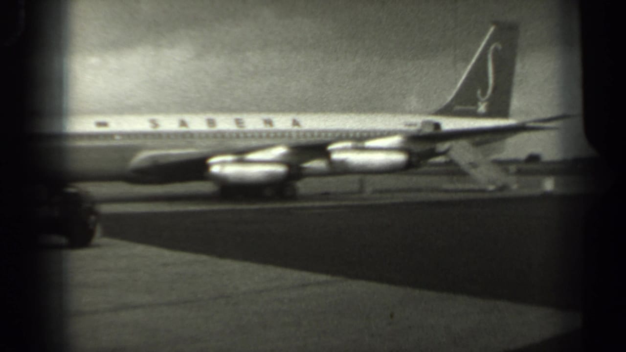 Sabena airliner seen from the side on a tarmac, with engines and tail visible.