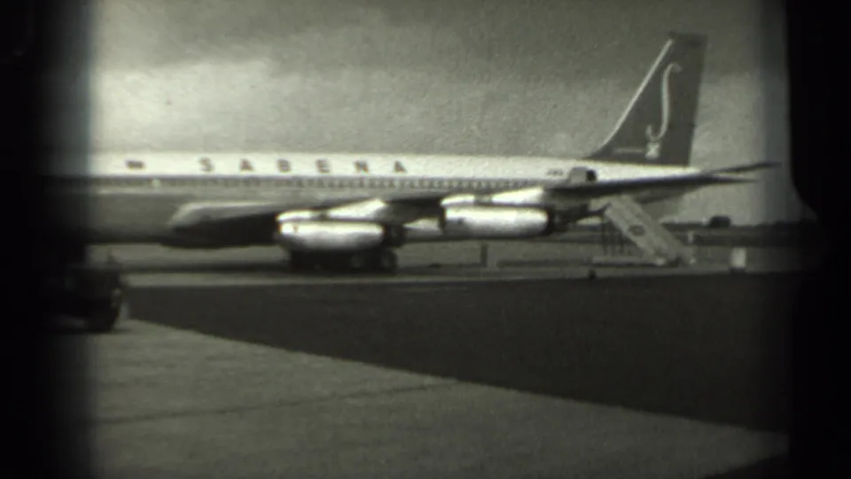 1961 Missouri tarmac view of a Sabena jetliner, with its tail logo, engine pods, and mobile stairs visible beside the aircraft.