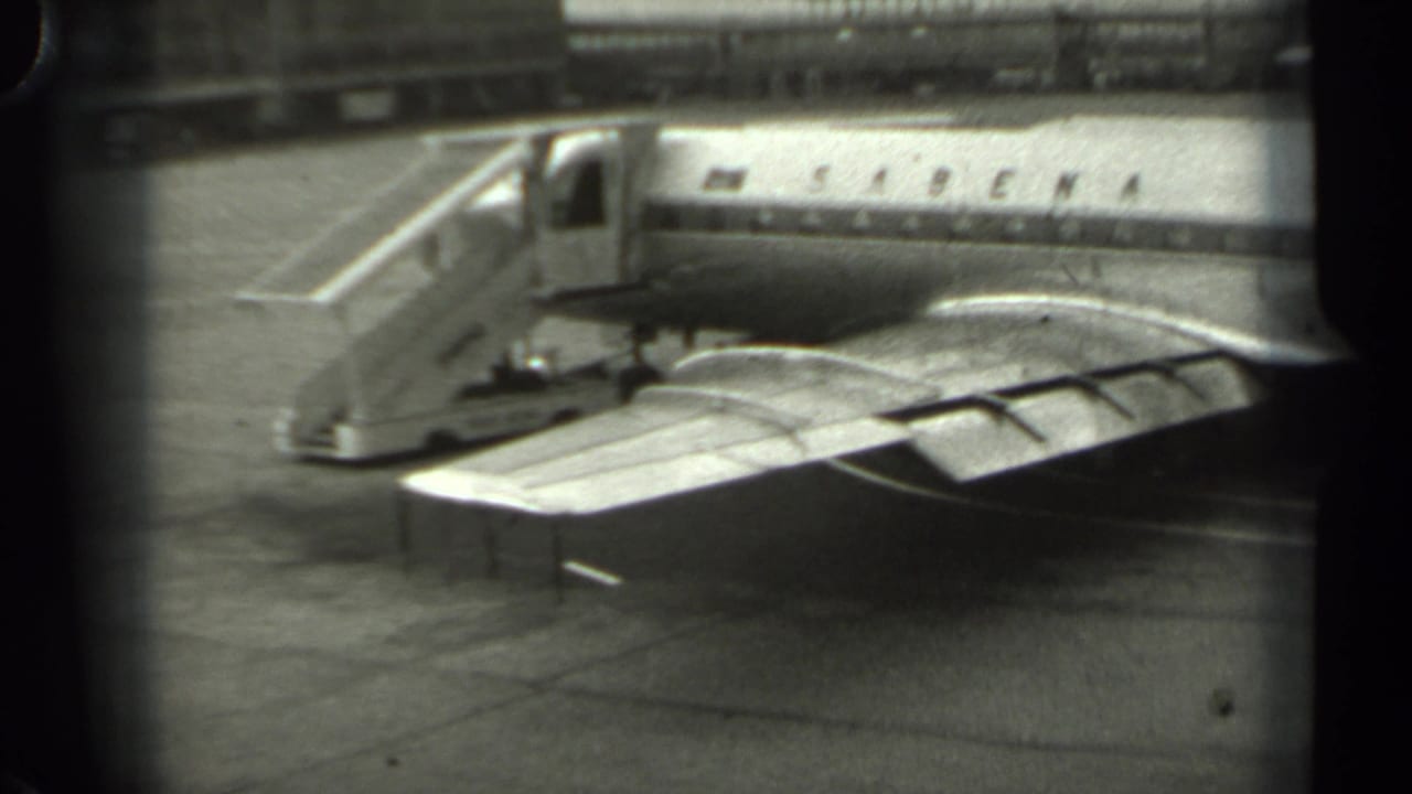 Sabena airplane parked on tarmac with mobile boarding stairs beside the fuselage.