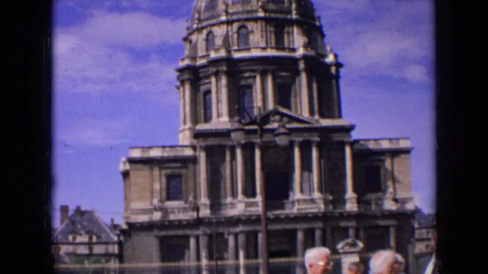 Handheld 1963 France home-movie view of a domed religious building with older men at the lower edge.