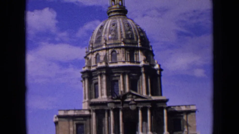 1963 France frame emphasizing the dome and upper stone architecture of the cathedral or church exterior.