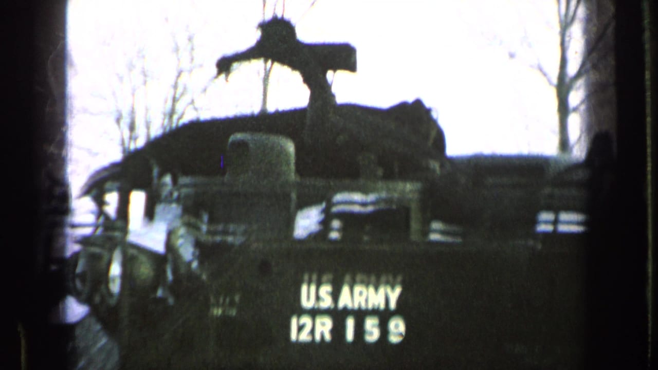 Rear view of an armored vehicle marked U.S. Army 12R 159.