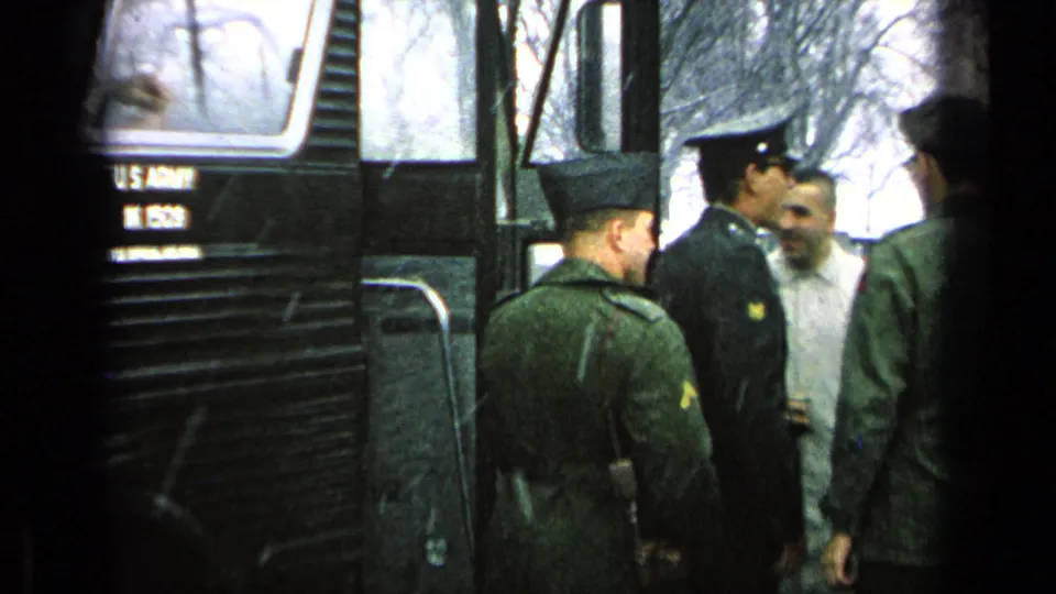 U.S. Army soldiers gather near an open transport bus door at a German military base, from 1963 metadata.